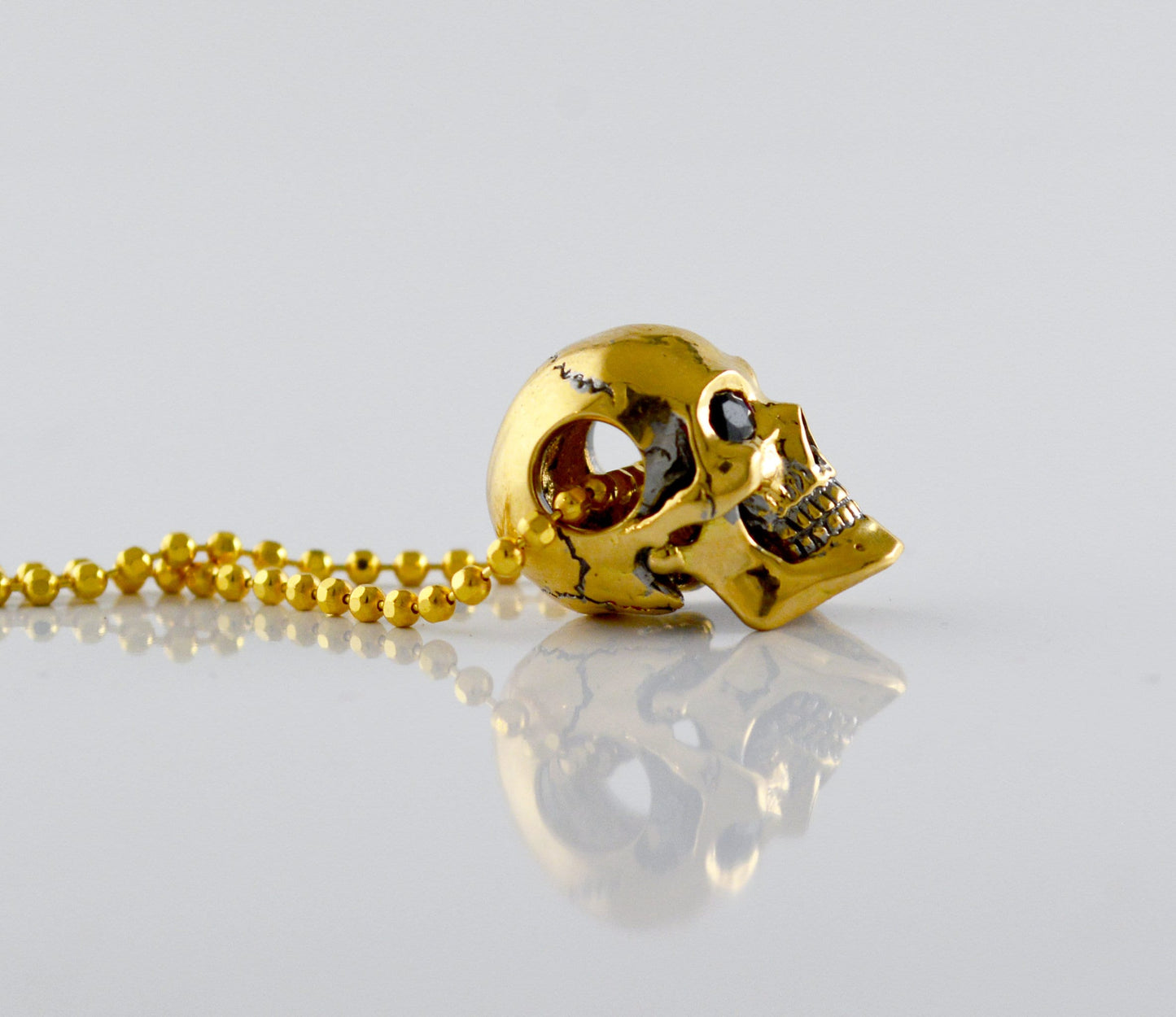 Colgante cráneo humano en oro, Calavera hecha a mano en oro de 14k y 18k - D´Cast